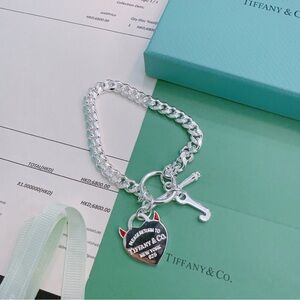 Tiffany & Co. Silver Chain Bracelet with Heart Tag and Red Accents